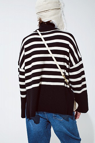 Black oversized trutleneck sweater with white stripes and splits on the side